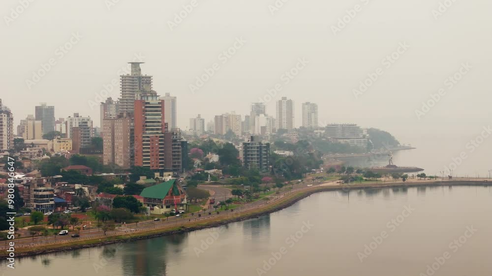 Toxic atmosphere of pollution covers city on banks of Parana River. Posadas, Misiones, Argentina. Toxic atmosphere of pollution covers city on banks of Parana River. Posadas, Misiones, Argentina.