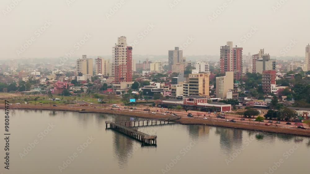 Skyline of city under heavy smog due to air pollution over Parana riverside. Posadas, Misiones, Argentina. Skyline of city under heavy smog due to air pollution over Parana riverside. Posadas, Misiones, Argentina.