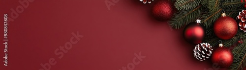 minimal top view of Christmas decorations on a bordeaux background with space for text or ads photo