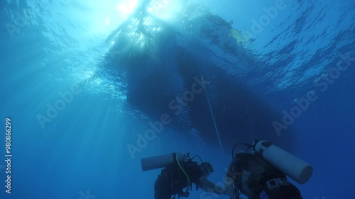 Wallpaper Mural scuba divers ascending descending on the line of boat rope underwater blue ocean scenery Torontodigital.ca