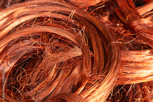 Scrap copper stripped cables twisted and collected in a heap, close-up.