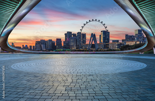 Empty square floor and bridge with modern city buildings scenery at dusk. car advertising background. photo