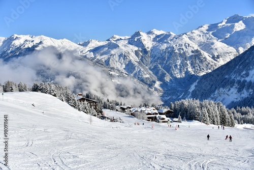 Winter scenery of  skiing tourists in Courchevel ski resort by winter
