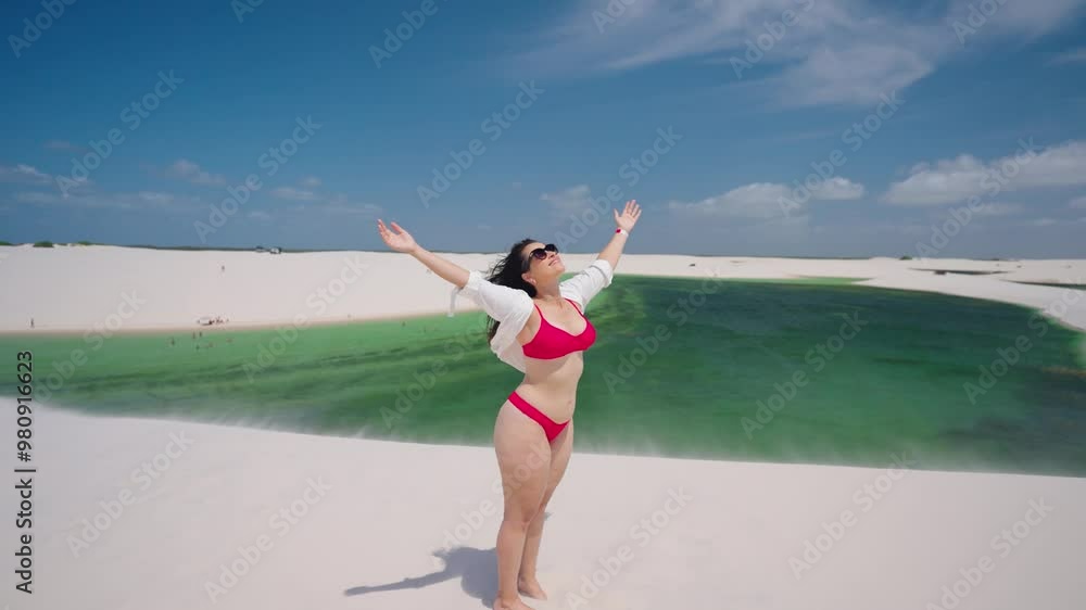 Female tourist walking on Lencois Maranhenses at Brazil Maranhao state. Enjying view of Exotic dunes summer landscape. Paradise Lencois Maranhenses. Tropical travel. Famous landmark.
Female tourist walking on Lencois Maranhenses at Brazil Maranhao state. Enjying view of Exotic dunes summer landscape. Paradise Lencois Maranhenses. Tropical travel. Famous landmark.
