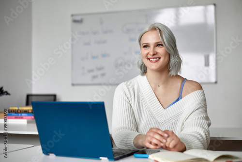 A young English teacher in his office at work. Additional education and retraining