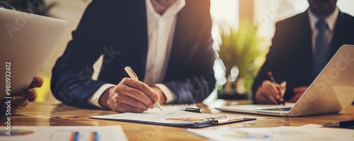 Close-up of Man's Hand Writing on a Clipboard with a Blurred Background, Businessman, Financial Planning, Teamwork, Strategy, Analysis, business
