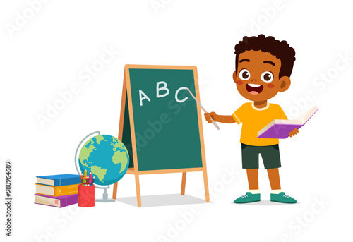little kid writing on blackboard with chalk to study