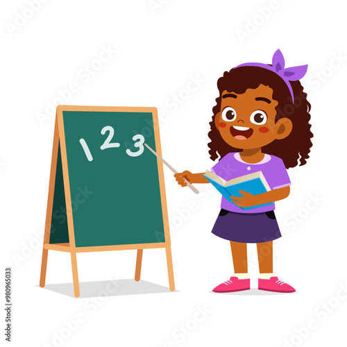 little kid writing on blackboard with chalk to study