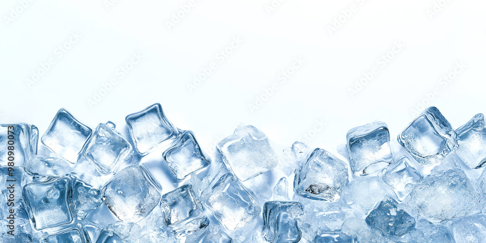 Top view of light blue crushed ice on a white surface. White background with melting ice cubes. Top view of light blue crushed ice on a white surface. White background with melting ice cubes.