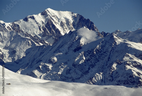Majestic Snow-Capped Mountain Range in Bright Blue Sky