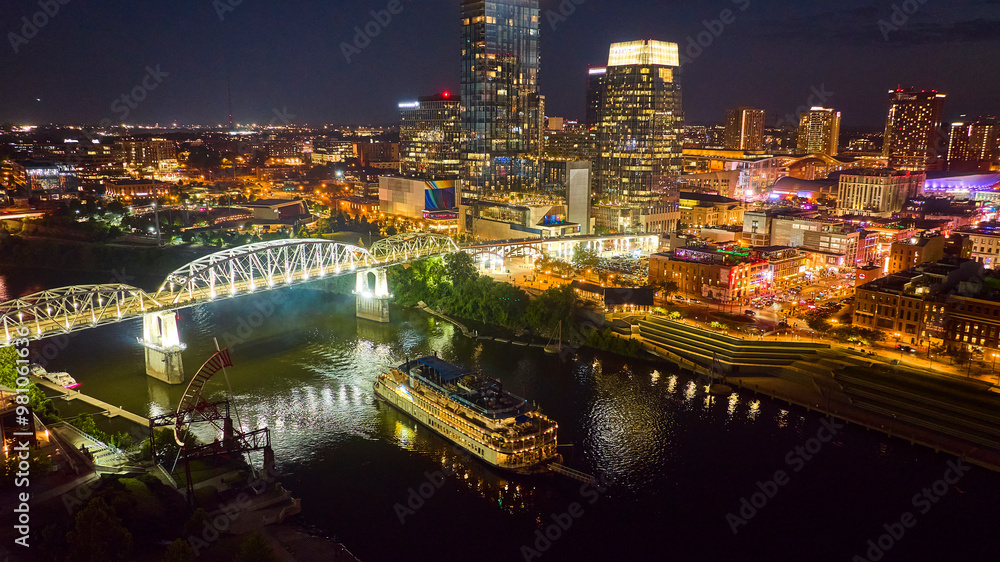 Fototapeta premium Aerial View of Nashville Night Skyline with John Seigenthaler Bridge