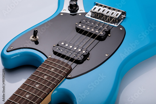 Close-up of blue electric guitar steel strings.  Close-up image. Studio shot. 