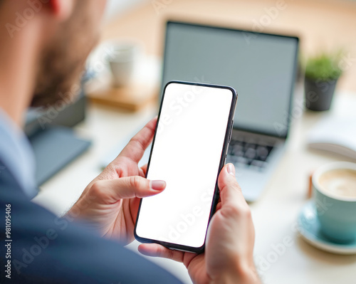 man woman holding a phone with a white screen close-up, copy space