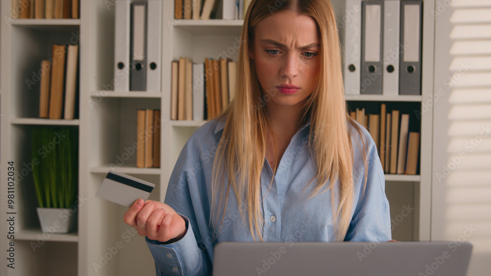Confused puzzled client female hold bank credit card try to pay online ...
