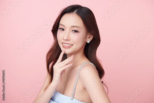 Beautiful young asian woman with clean fresh skin on pink background, Face care, Facial treatment, Cosmetology, beauty and spa, Asian women portrait.