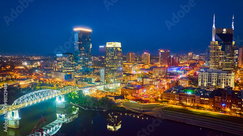 Aerial Nashville Skyline at Night Over Cumberland River photo