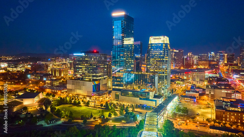 Aerial Nashville Skyline at Night with Illuminated Skyscrapers and Green Space photo