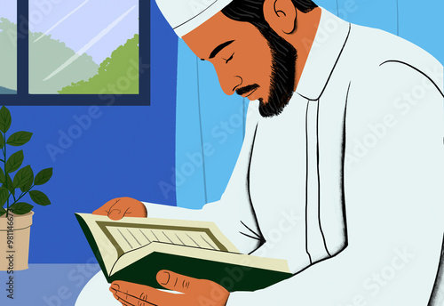 A man in traditional Islamic attire engrossed in reading the Quran indoors beside a potted plant. photo