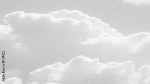 White Clouds from above. Aerial view of the fluffy white cloud on blue sky. Top view from an airplane over white clouds