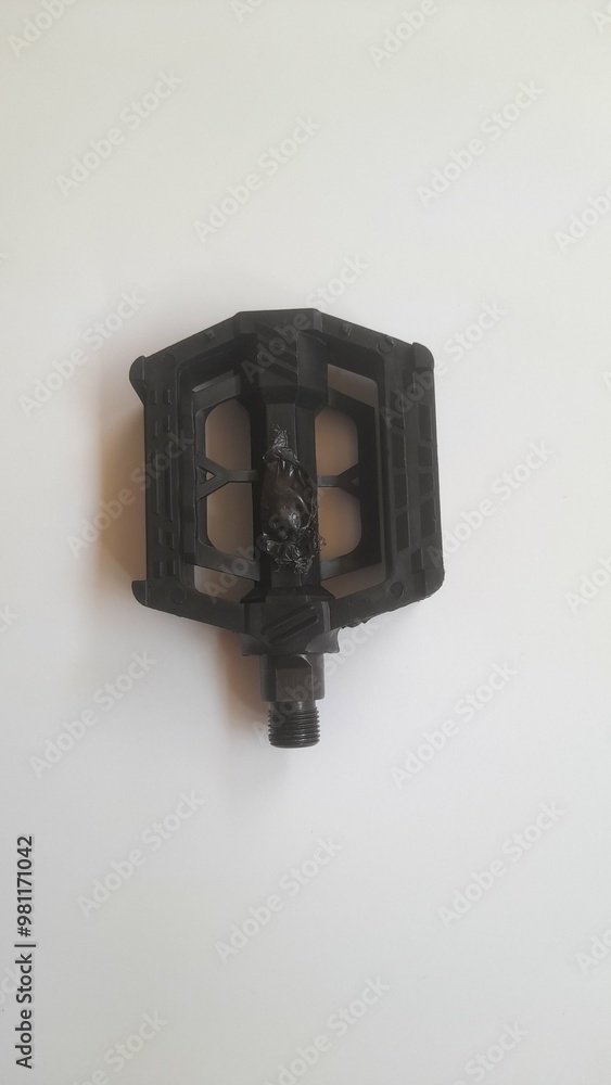Top view of black bicycle pedals on a white background. background concept of transport, transportation, hobby, lifestyle, accessories, fashion, Wheel, fashionable, cycling, cycle, elegance, steel Top view of black bicycle pedals on a white background. background concept of transport, transportation, hobby, lifestyle, accessories, fashion, Wheel, fashionable, cycling, cycle, elegance, steel