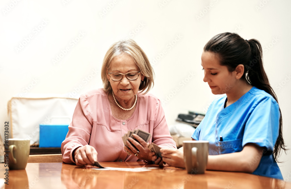 Senior, woman and caregiver with playing cards for fun, memory exercise or happy company in retirement. Poker, game and old person at table bonding with nurse, companion or nursing home employee. Senior, woman and caregiver with playing cards for fun, memory exercise or happy company in retirement. Poker, game and old person at table bonding with nurse, companion or nursing home employee.