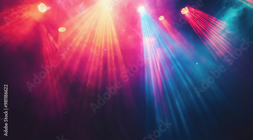 Colorful beams of red and blue stage lights shining through fog in a dramatic atmosphere.
