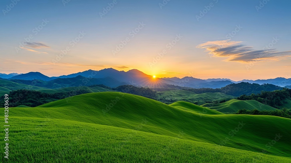 Obraz premium Golden sunset sky over rolling hills, minimalistic background, soft warm hues, smooth gradient tones, calm and serene atmosphere, balanced light, breathtaking view