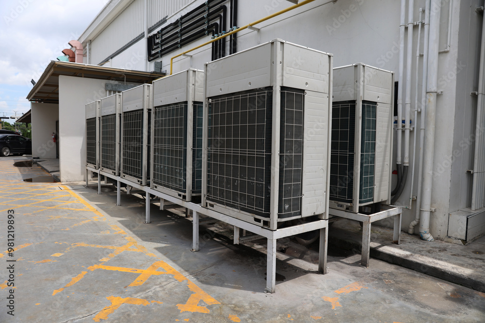 Air conditioner compressor installed in old building. Outdoor split wall type air conditioner compressor unit inverter installed on the outside of the building. Air conditioner compressor outdoor unit Air conditioner compressor installed in old building. Outdoor split wall type air conditioner compressor unit inverter installed on the outside of the building. Air conditioner compressor outdoor unit