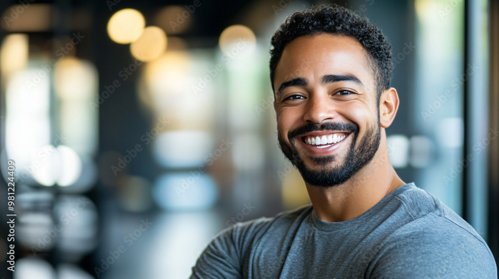 Successful young businessman exuding confidence and smiling in a contemporary office environment, showcasing dedication and achievement in the corporate world Successful young businessman exuding confidence and smiling in a contemporary office environment, showcasing dedication and achievement in the corporate world