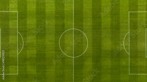 Obraz na płótnie Perpendicular aerial view of an natural turf soccer field. The sports facility is empty. w salonie