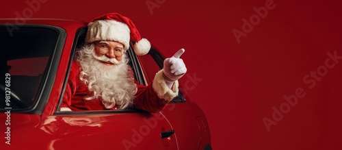 Obraz na płótnie Santa giving a thumbs up in a red car, red background. w salonie