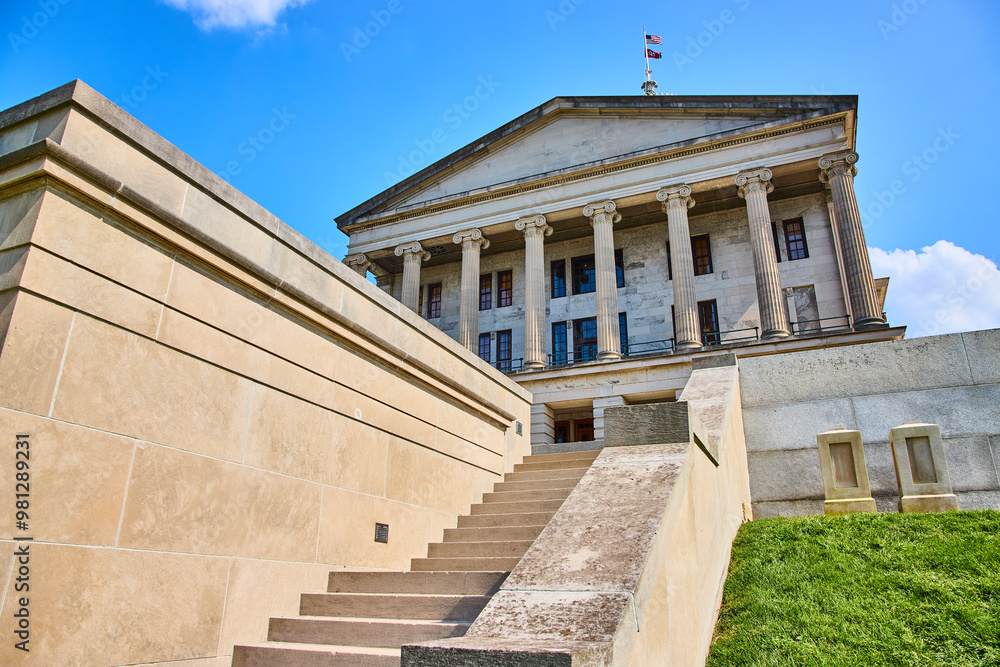 Tennessee State Capitol with American Flag and Columns Upward View Tennessee State Capitol with American Flag and Columns Upward View