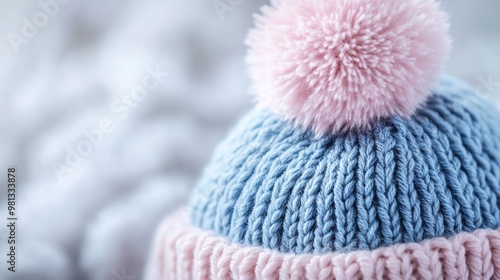 Knitted blue and pink winter hat with