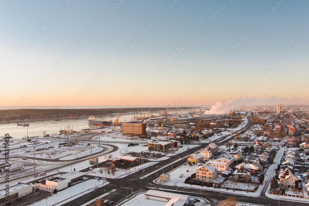 Aerial view of Klaipeda city port area and it's surroundings on sunny winter evening. The Old town of Klaipeda, Lithuania in evening light at wintertime. Aerial view of Klaipeda city port area and it's surroundings on sunny winter evening. The Old town of Klaipeda, Lithuania in evening light at wintertime.