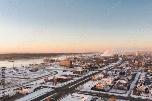 Aerial view of Klaipeda city port area and it's surroundings on sunny winter evening. The Old town of Klaipeda, Lithuania in evening light at wintertime.