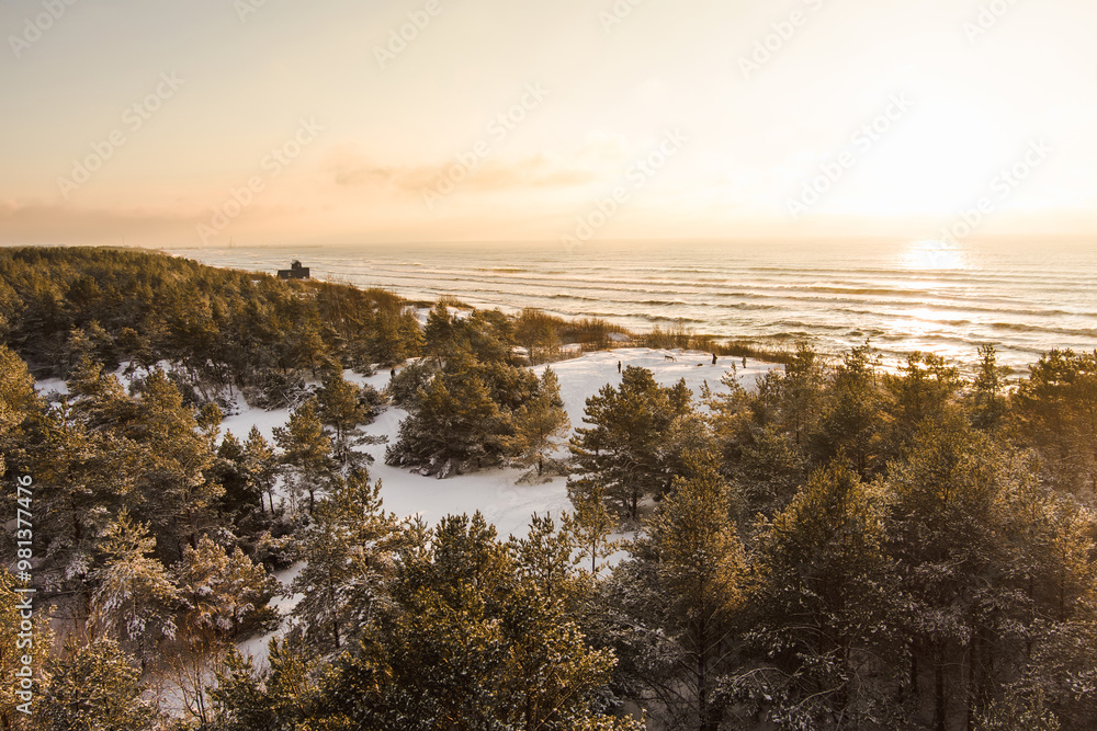 Aerial view of the Baltic Sea shore line near Klaipeda city, Lithuania. Beautiful sea coast on chilly and snowy winter day. Aerial view of the Baltic Sea shore line near Klaipeda city, Lithuania. Beautiful sea coast on chilly and snowy winter day.