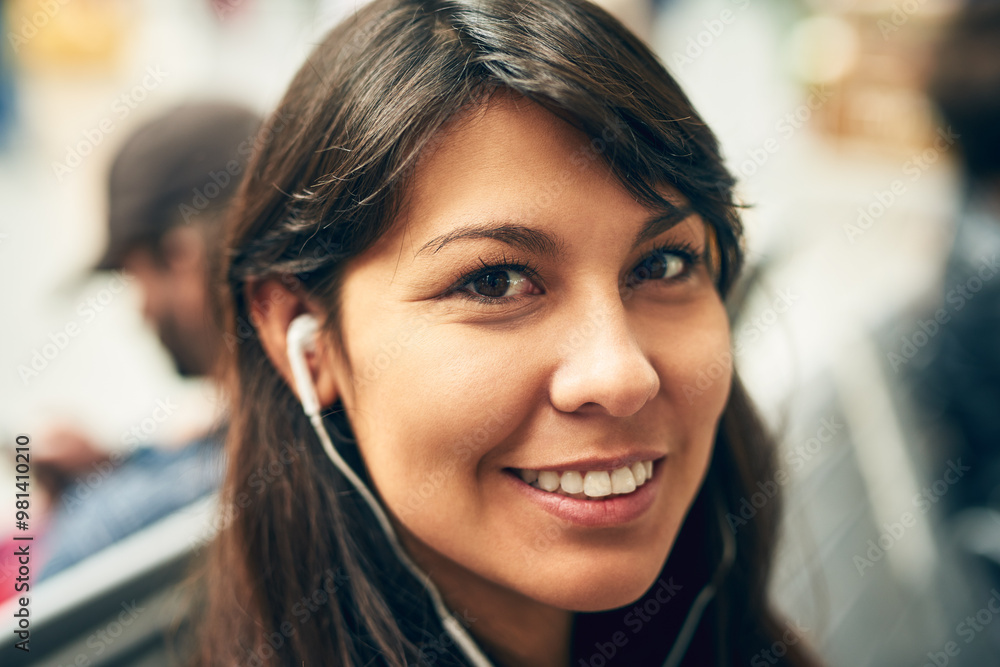 Woman, earphones and portrait in city at bus station with smile for listening to music on travel. Person, happy and hearing audio with streaming subscription on metro road for transport in Colombia Woman, earphones and portrait in city at bus station with smile for listening to music on travel. Person, happy and hearing audio with streaming subscription on metro road for transport in Colombia