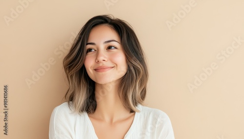 minimalistic portrait of beautiful caucasian smiling woman with blond hair on beige color background, copy space, natural beauty