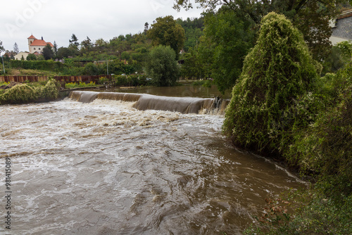 Weir on the Svitava River in the city of Brno, a local part of the Obrany. Big water after rain.