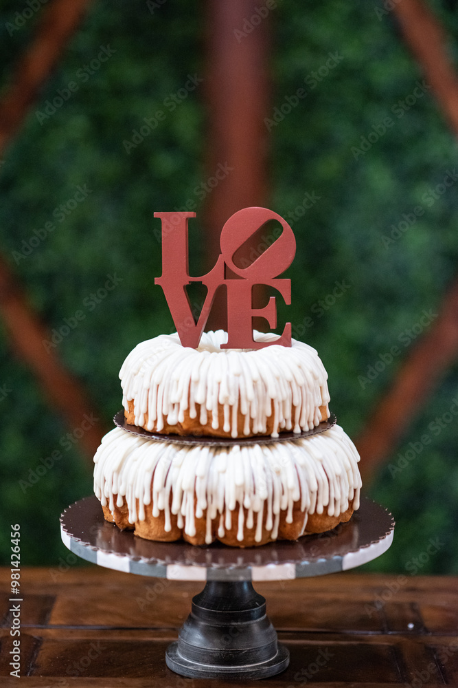 A wedding cake with the word Love