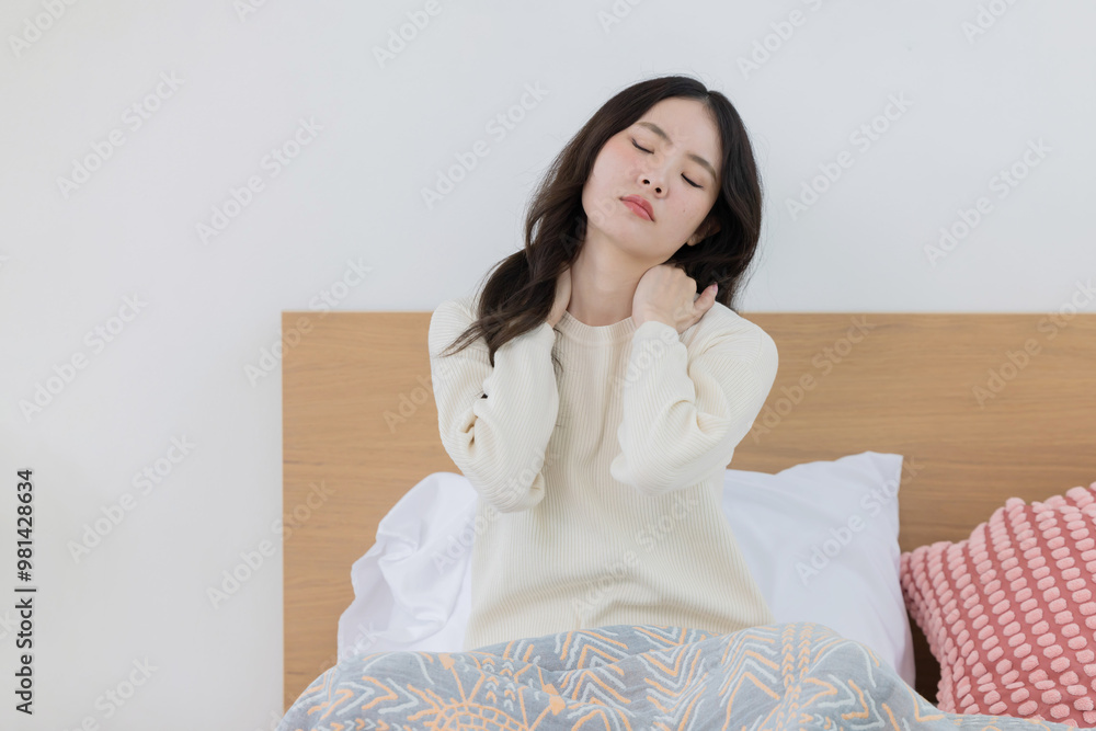 Woman suffer from neck pain after wake up in the morning Woman suffer from neck pain after wake up in the morning