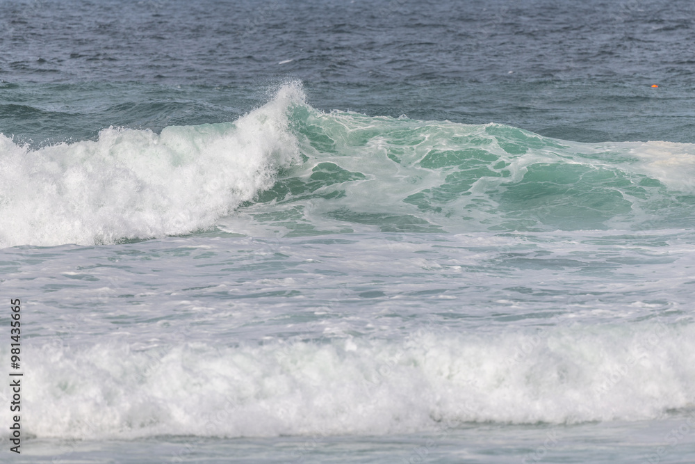 Wave of the green and blue Atlantic Ocean at the edge of a beach in the Iroise Sea. Wave of the green and blue Atlantic Ocean at the edge of a beach in the Iroise Sea.