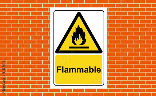 Flammable substances yellow warning sign on the wall