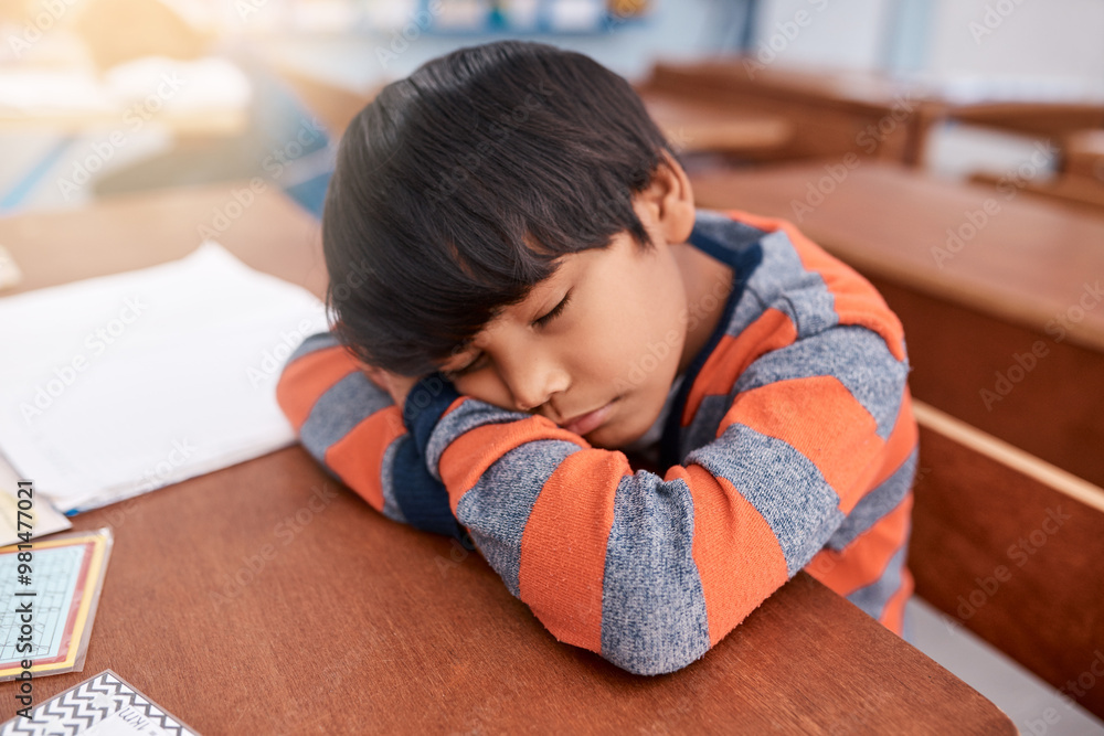 Desk, exhausted and sleeping with boy student in classroom at school for child development or learning. Burnout, fatigue and tired with learner kid at table in class for education, learning or study Desk, exhausted and sleeping with boy student in classroom at school for child development or learning. Burnout, fatigue and tired with learner kid at table in class for education, learning or study