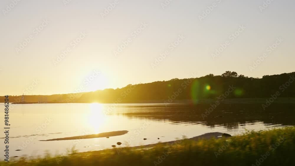 Peaceful Lakeside Drive At Sunset In The Countryside Peaceful Lakeside Drive At Sunset In The Countryside