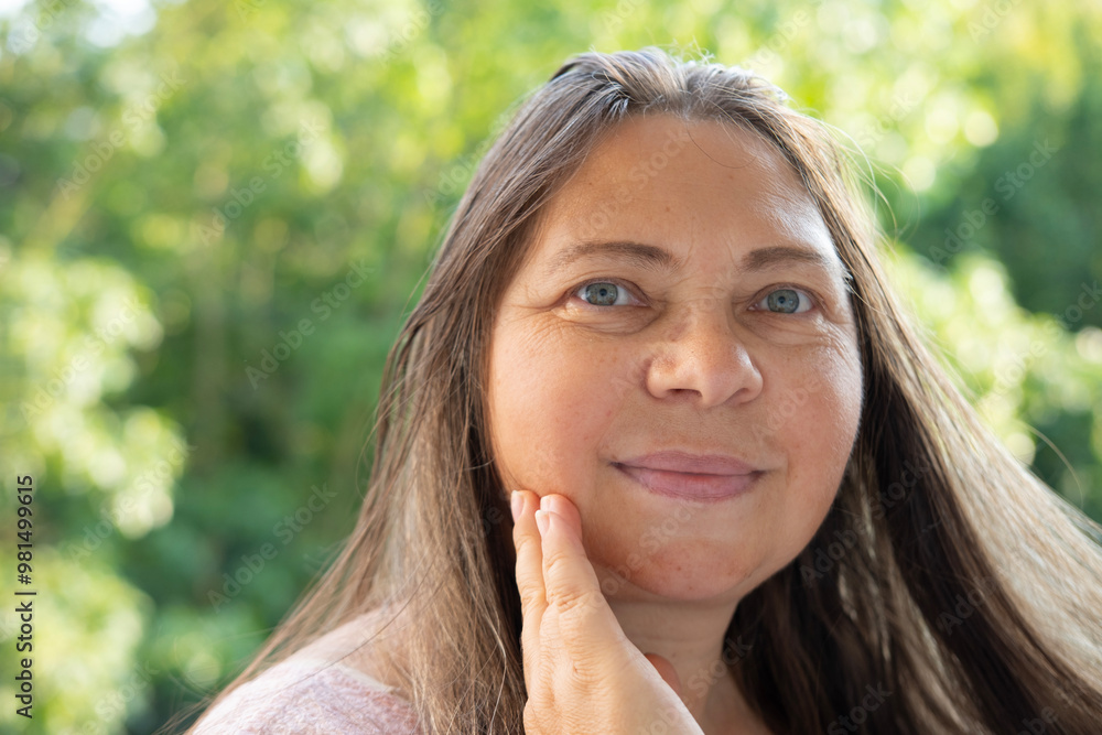 mature woman with long brown hair, age-related changes, Aging gracefully, gravitational ptosis, natural beauty, skincare routine mature woman with long brown hair, age-related changes, Aging gracefully, gravitational ptosis, natural beauty, skincare routine