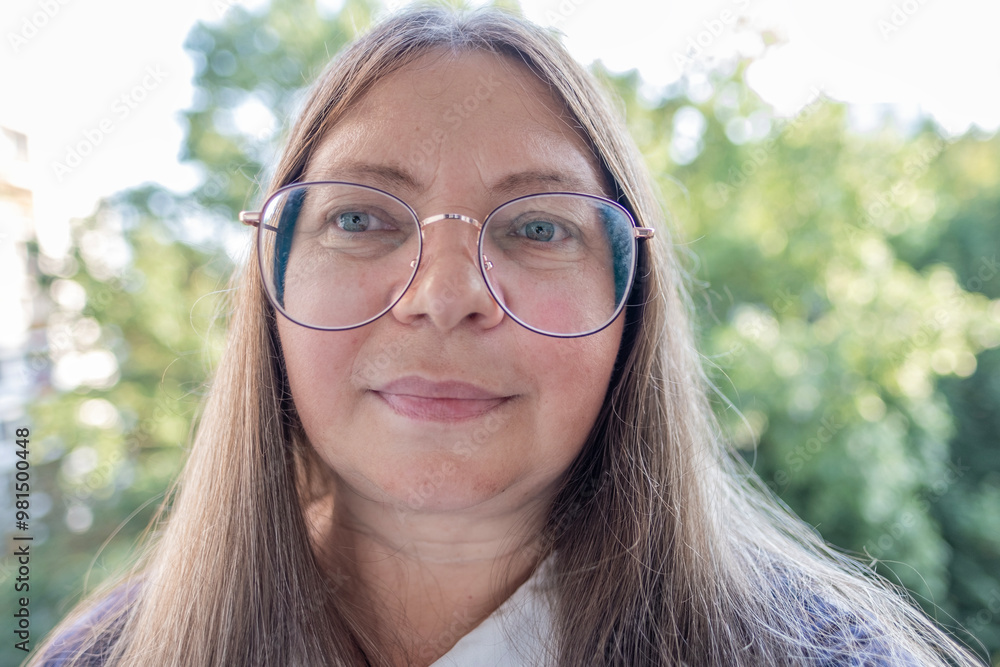 close-up stylish charismatic mature woman wearing glasses with long brown hair, age-related changes, smiling confidently, positivity and enthusiasm, positive energy close-up stylish charismatic mature woman wearing glasses with long brown hair, age-related changes, smiling confidently, positivity and enthusiasm, positive energy