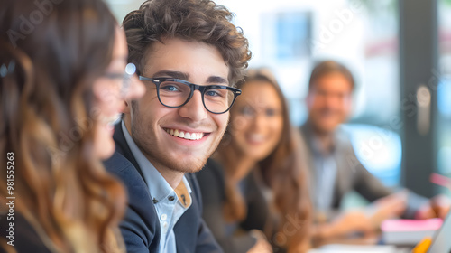 Smiling young business people having a meeting in office