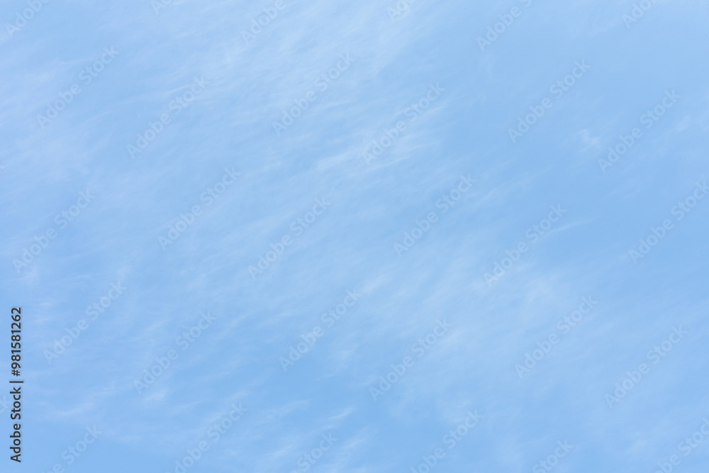 Obraz premium Clouds floating through the blue, creating harmony and peace