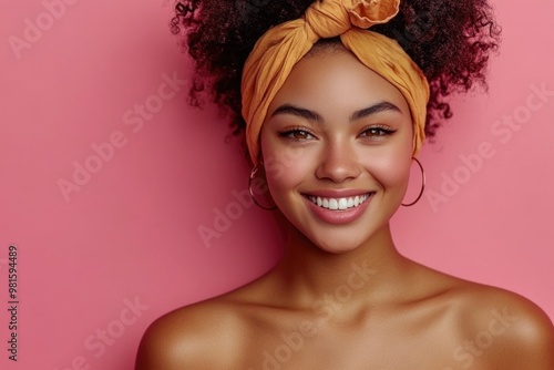 Happy Young Woman Holding Credit Card Holder Against a Bright Pink Background